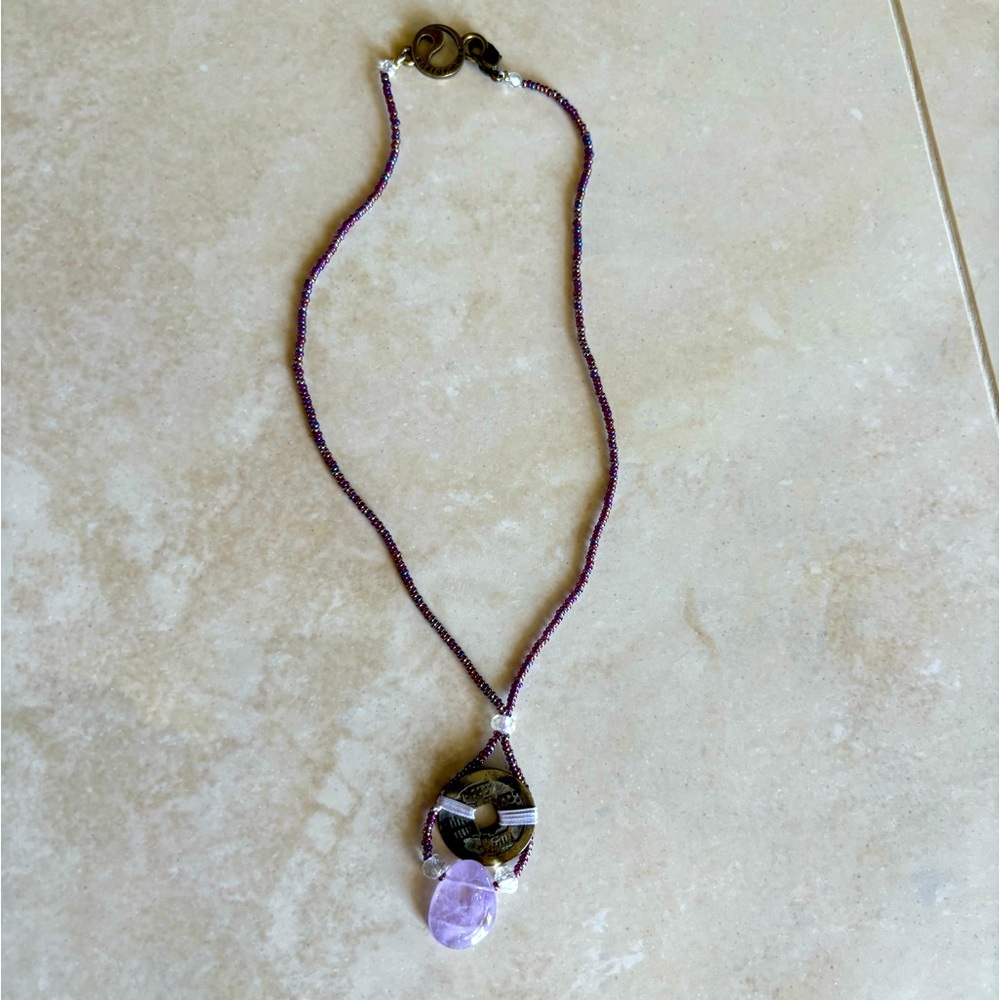 Energy Muse Brass Coin with Purple Beads, Thread and Pendant Stone